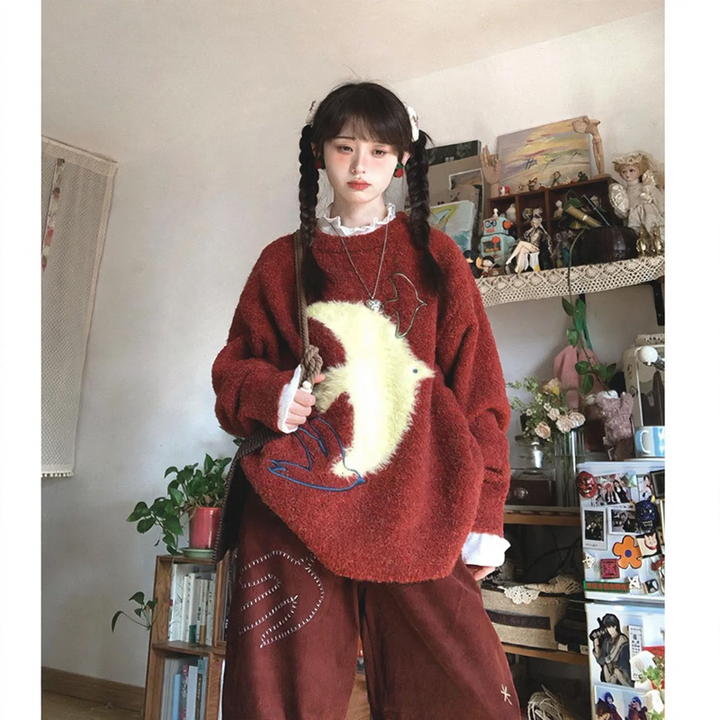 Women's knit sweater with bird jacquard