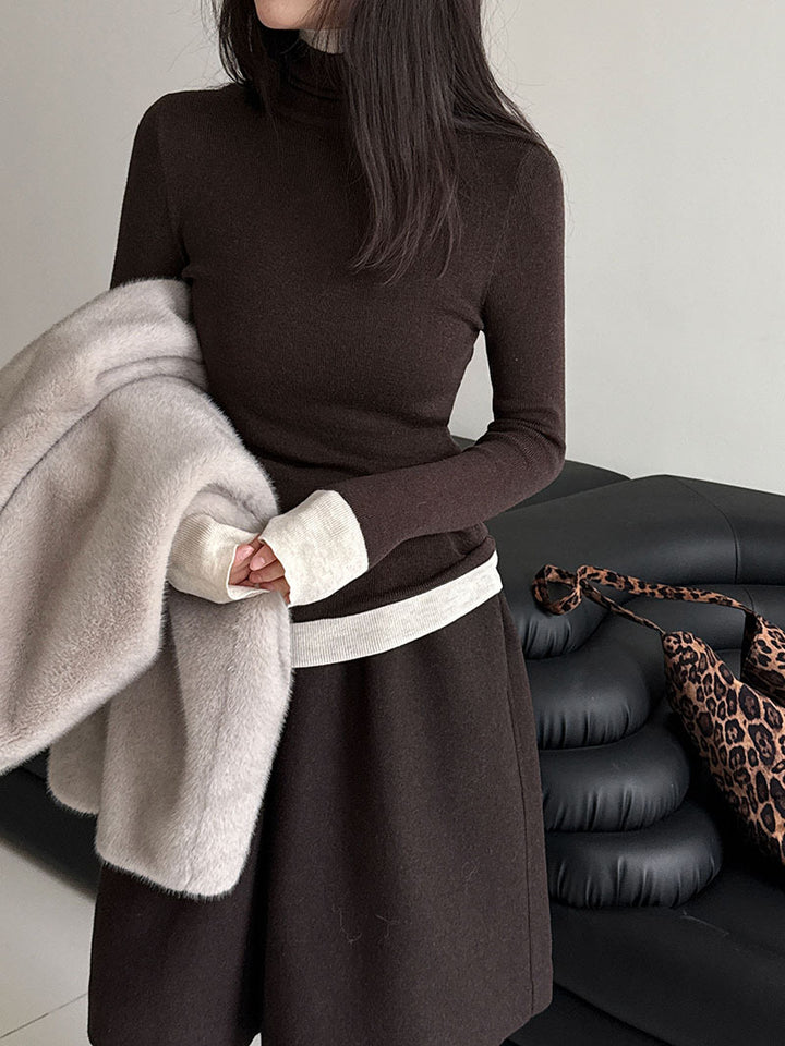 Women's knit pullover with stand-up collar and contrast details