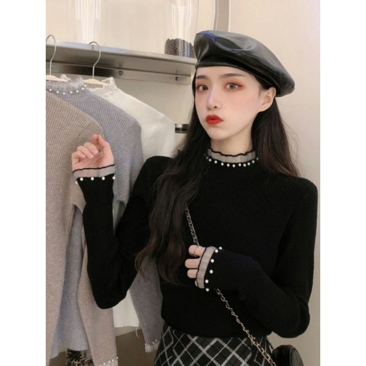 Ladies' knitted sweater with stand-up collar, lace and pearls