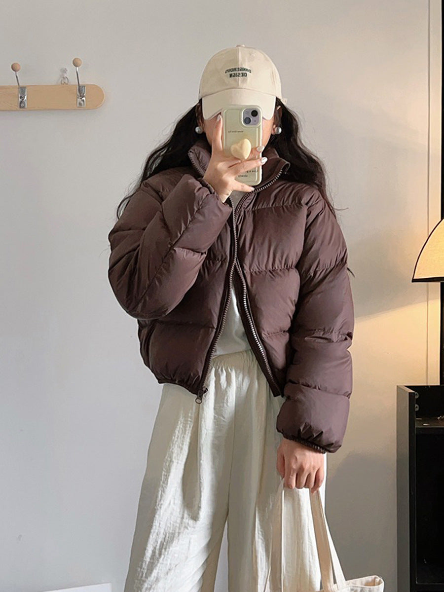 Short, padded women's winter jacket in puffer style