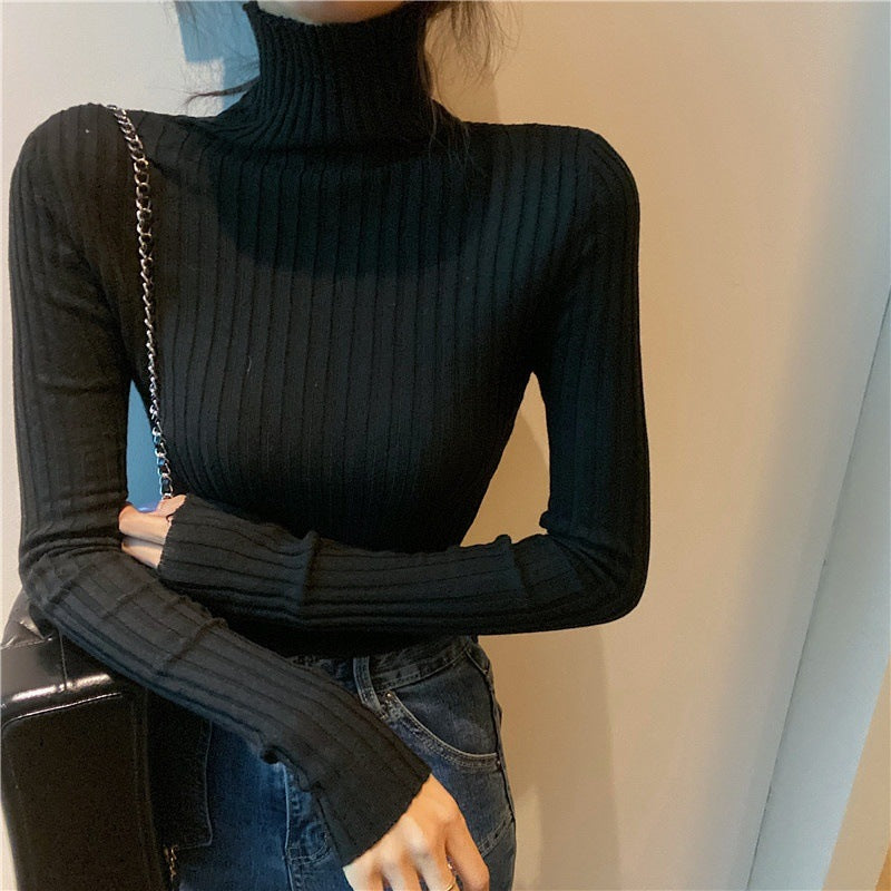 Elegant ladies' knitted pullover with stand-up collar, figure-hugging