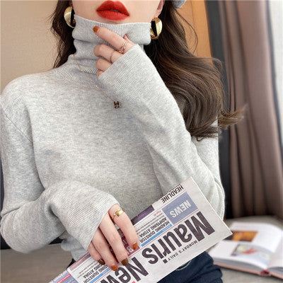 Women's knitted pullover with stand-up collar, slim fit