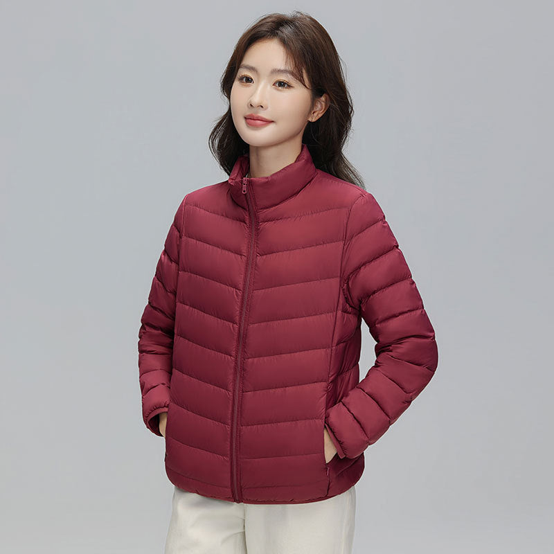 Light women's down jacket with stand-up collar, white duck down