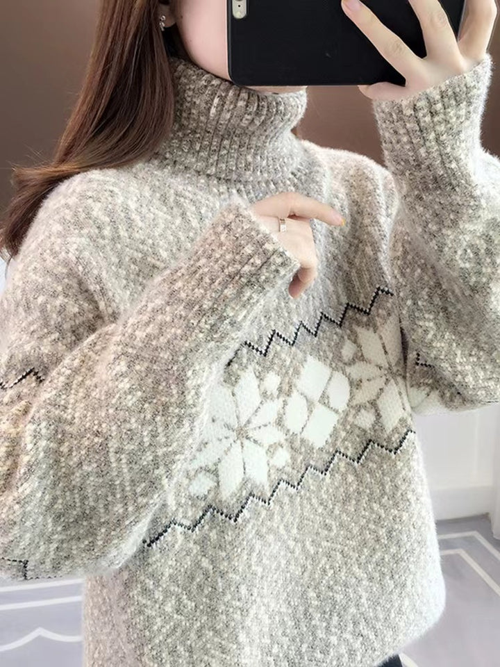 Women's knitted pullover with snowflake pattern and stand-up collar