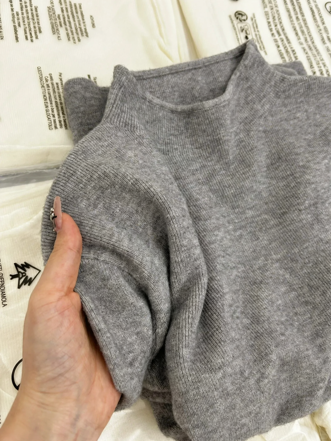 Women’s knit sweater with stand-up collar