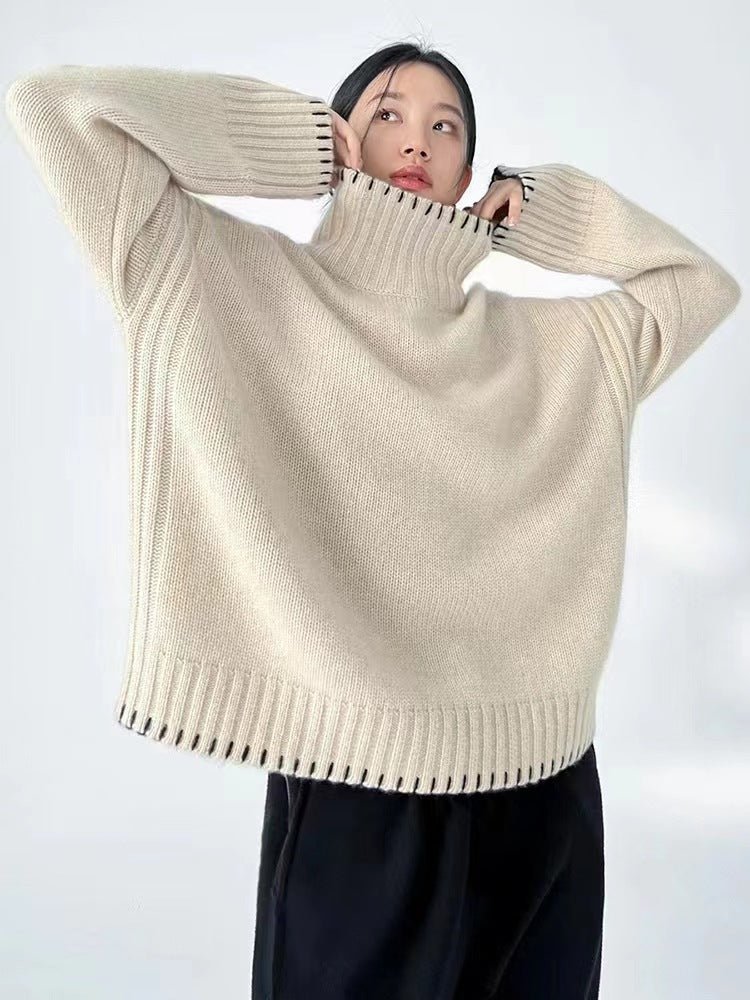 Women's knit sweater with cable pattern and turtleneck