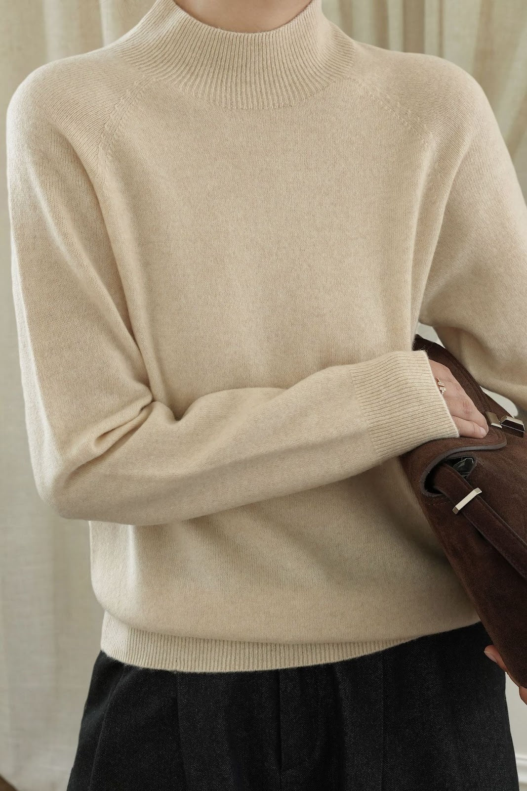 Women's wool sweater with stand-up collar, loosely knitted