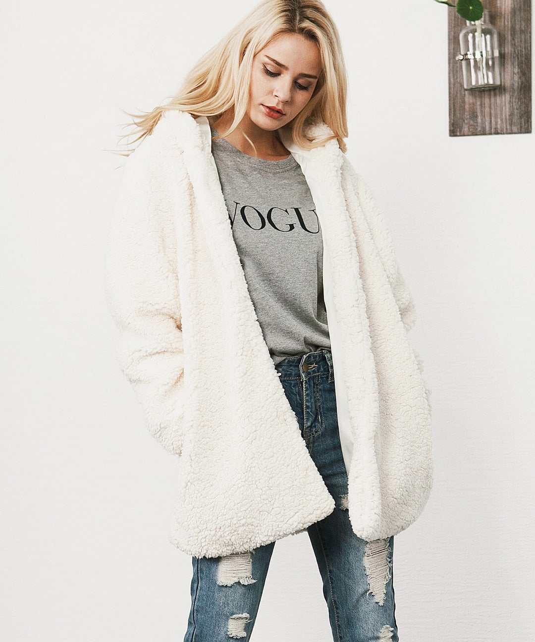 Long women's winter coat with hood in teddy look