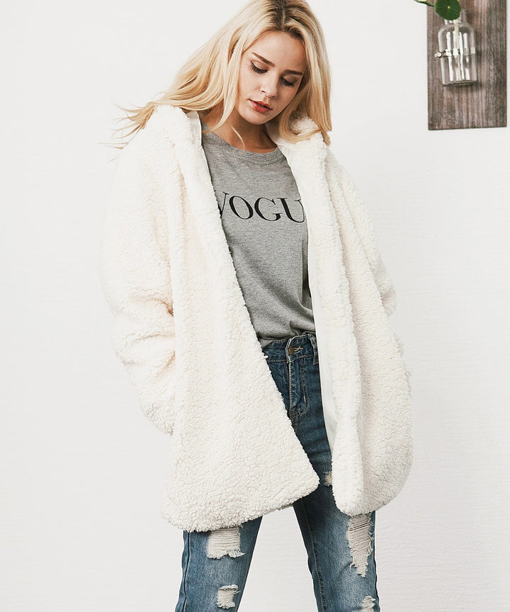 Long women's winter coat with hood in teddy look