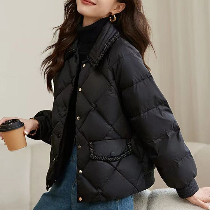 Short women's quilted jacket in diamond design