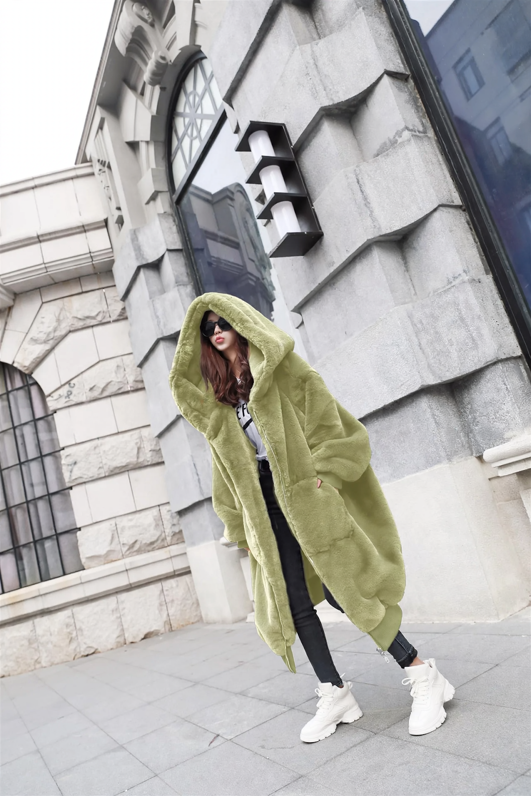 Long ladies' hooded jacket in rabbit fur look