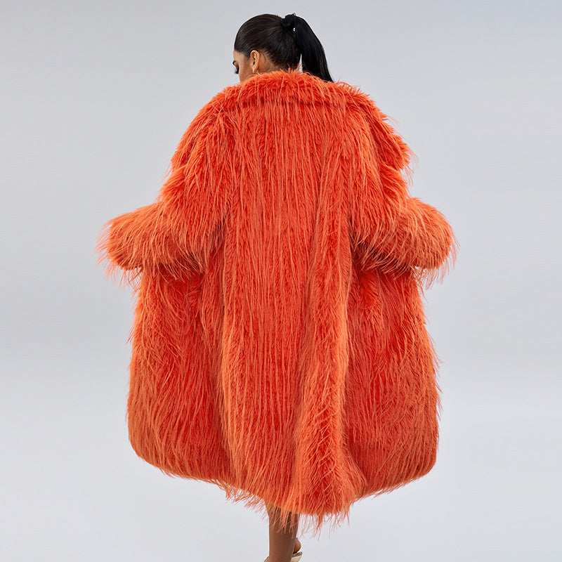 Long women’s faux fur coat with fringes