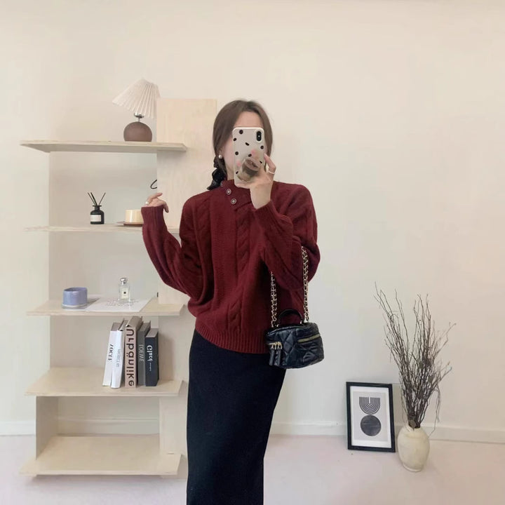 Short cable knit sweater with asymmetric neckline