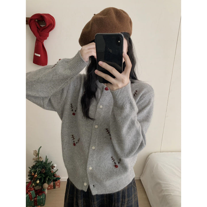 Festive knitted sweater with reindeer embroidery