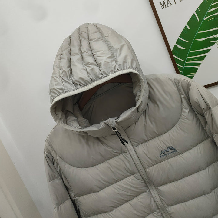 Light women's down jacket with hood, quilted