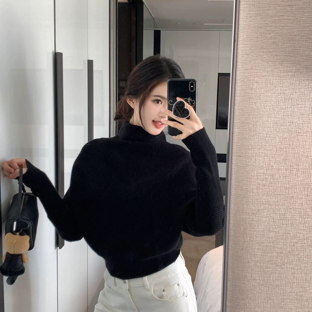 Women's knit sweater with turtleneck and bat sleeves