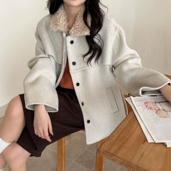 Women's coat with faux sheepskin details, lined