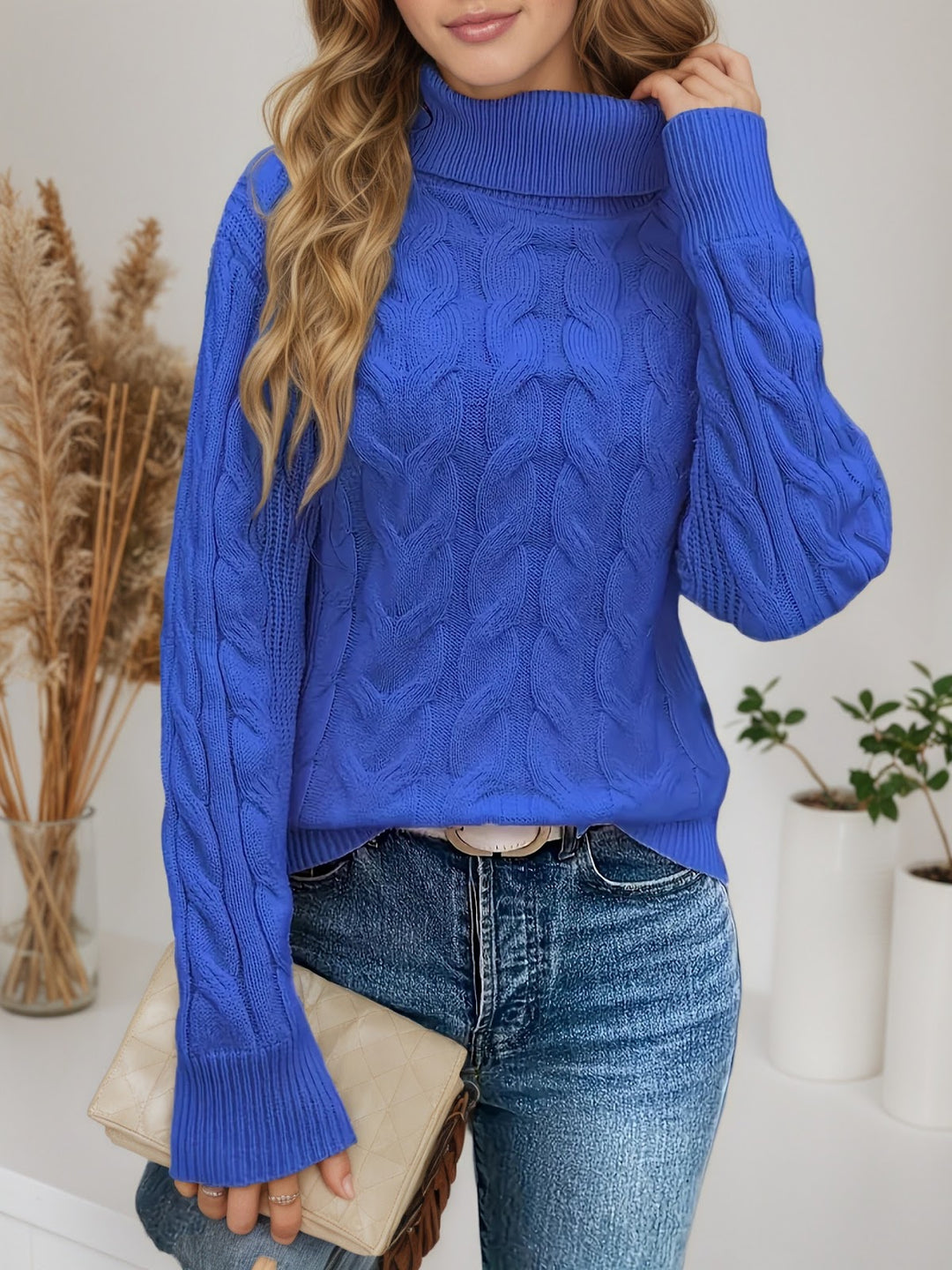 Knit sweater with cable pattern and high collar