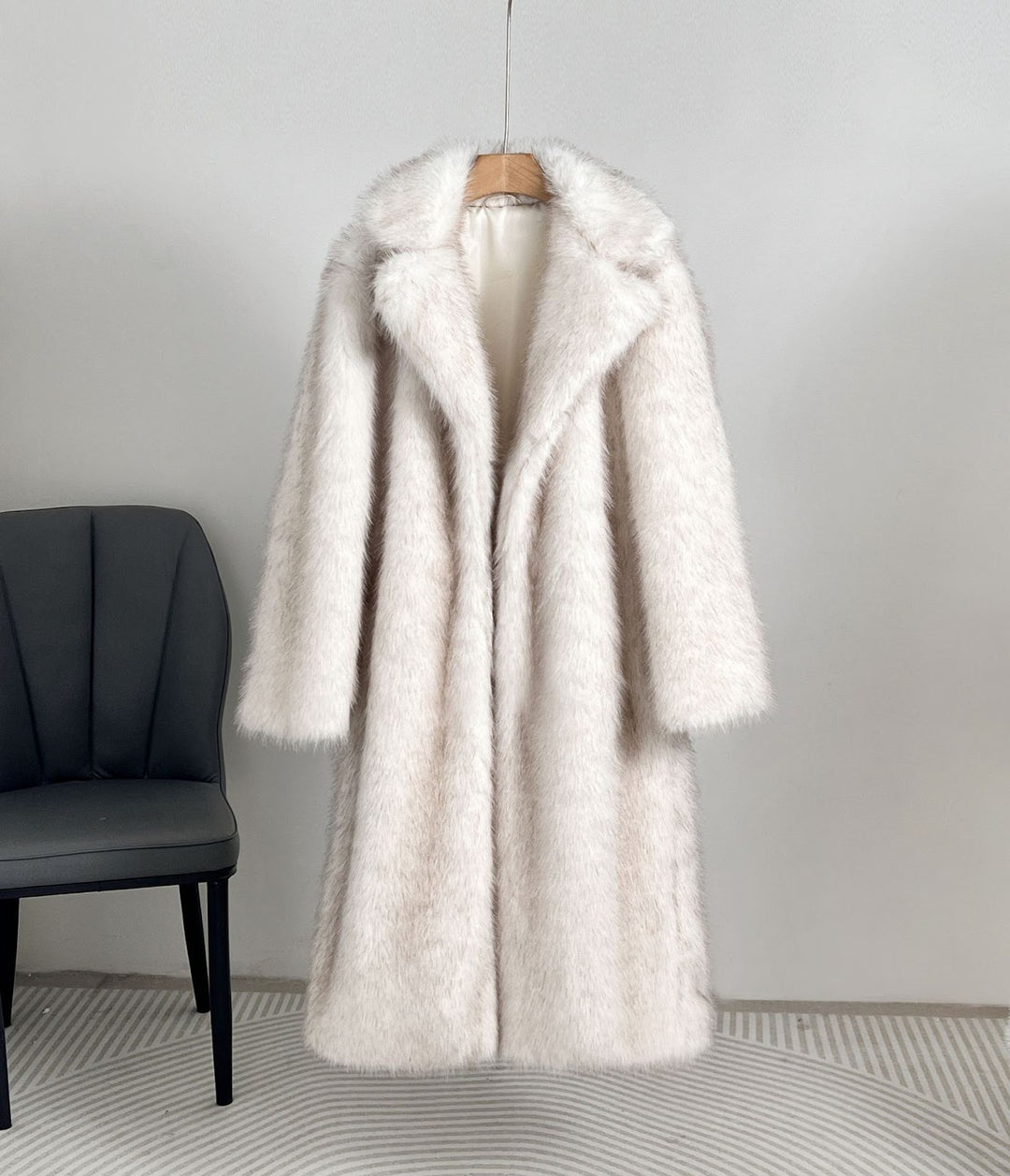Long women's faux fur coat with lapel collar