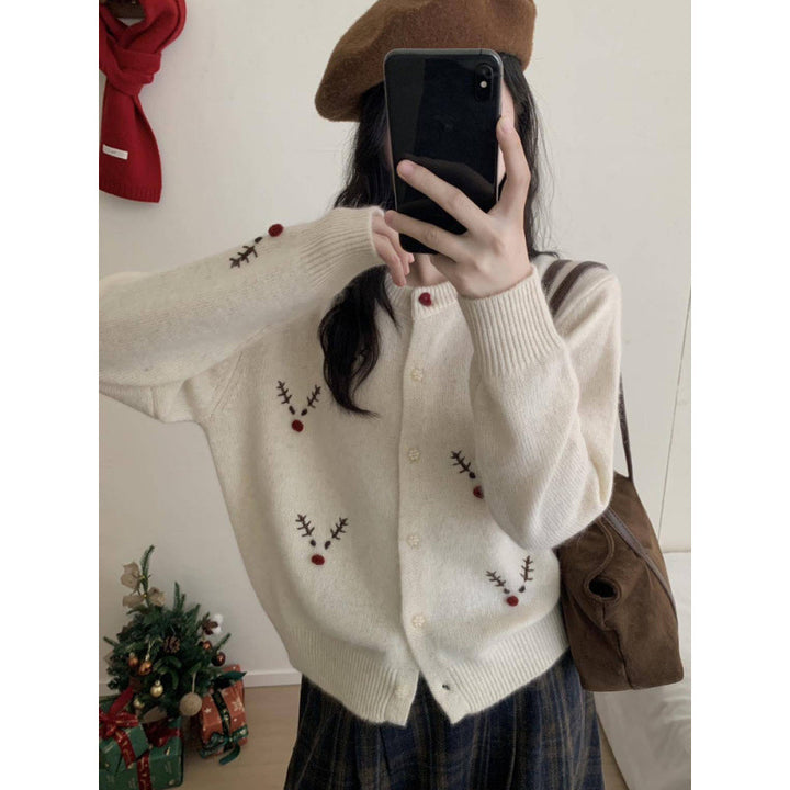 Festive knitted sweater with reindeer embroidery