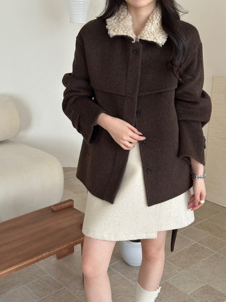 Women's coat with faux sheepskin details, lined