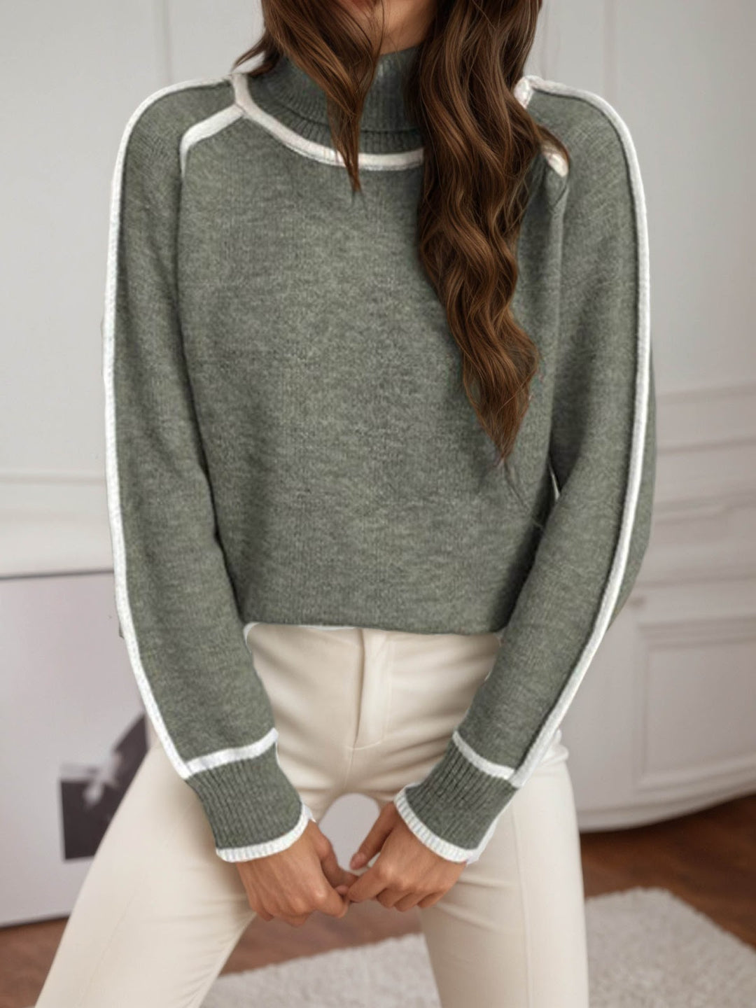 Women's knit pullover with stand-up collar and contrast details