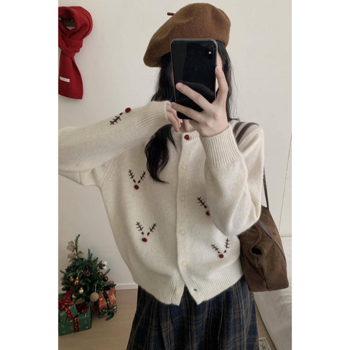 Festive knitted sweater with reindeer embroidery