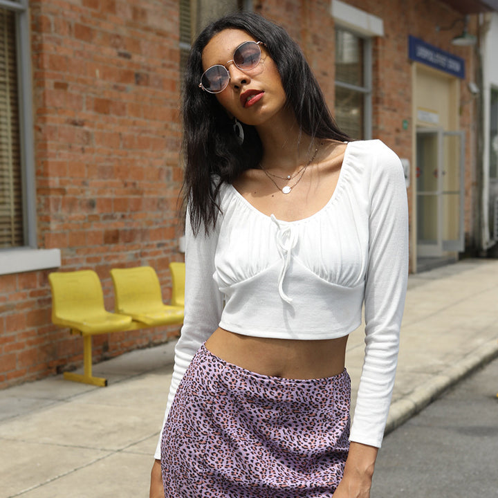 Women's fitted crop top with gathered bustier, boat neckline, and long sleeves Mune Fashion