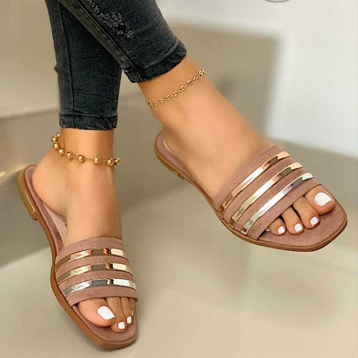 Ladies' flat slip-on sandals with multi-stripe metallic strips and padded comfort footbed Mune Fashion