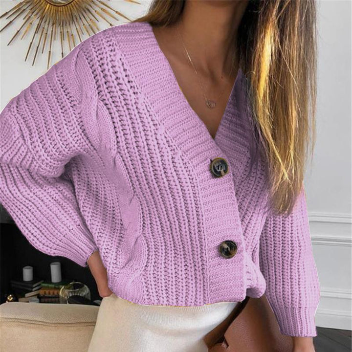 Women’s short cropped chunky knit cardigan with deep V-neck, cable pattern and oversized sleeves Mune Fashion