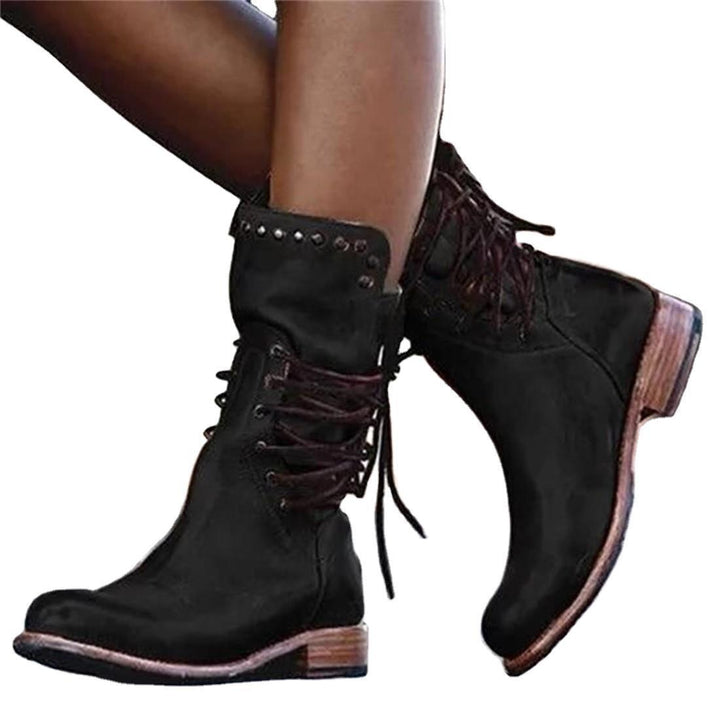 Women's rugged worker boots with decorative wrap lacing, metal eyelets, and profiled rubber outsole Mune Fashion