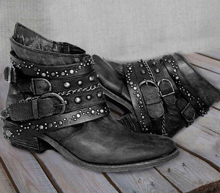 Women ankle-high biker ankle boots with multiple studded straps, decorative chains, and adjustable buckles Mune Fashion