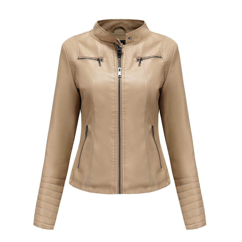 Women's fitted biker jacket made of faux leather with stand-up collar and quilted sleeve section Mune Fashion