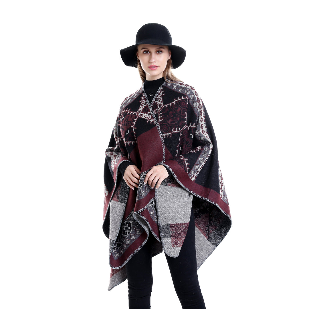 Women's Oversize Ruana Poncho made of jacquard fabric with asymmetrical pointed edge and ornamental border Mune Fashion