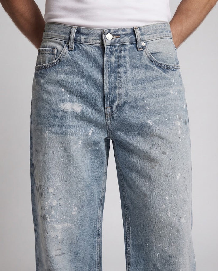Men's loose-fitting vintage denim jeans with used effects and paint splatter Mune Fashion