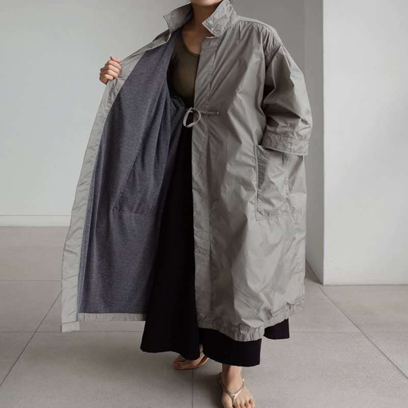 Ladies Longline Parka in lightweight windbreaker style with inner lining, drawstring and flap pockets Mune Fashion