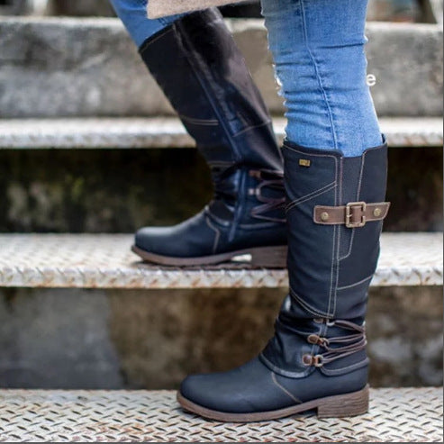 Women's knee-high boots in leather look with adjustable decorative straps and profile rubber sole Mune Fashion