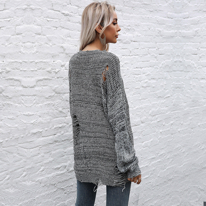 Ladies chunky knit oversized sweater with open stitches, raw hem and round neckline Mune Fashion