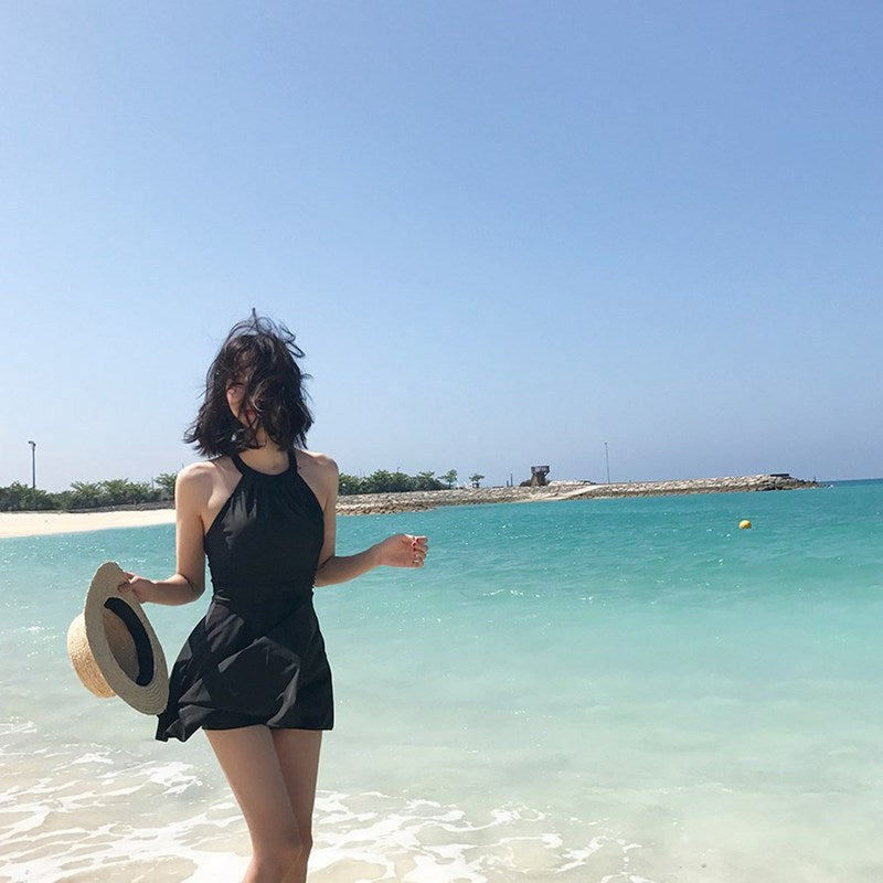 Women's swimsuit with fashionable back cut and playful skirt Mune Fashion