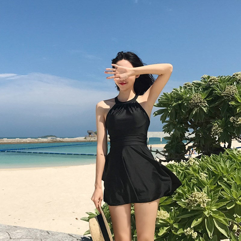 Women's swimsuit with fashionable back cut and playful skirt Mune Fashion