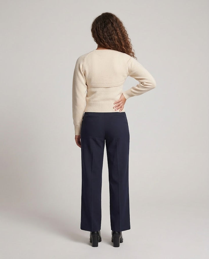 Women's fine knit sweater with cut-out shoulder detail and fitted ribbed waistband Mune Fashion