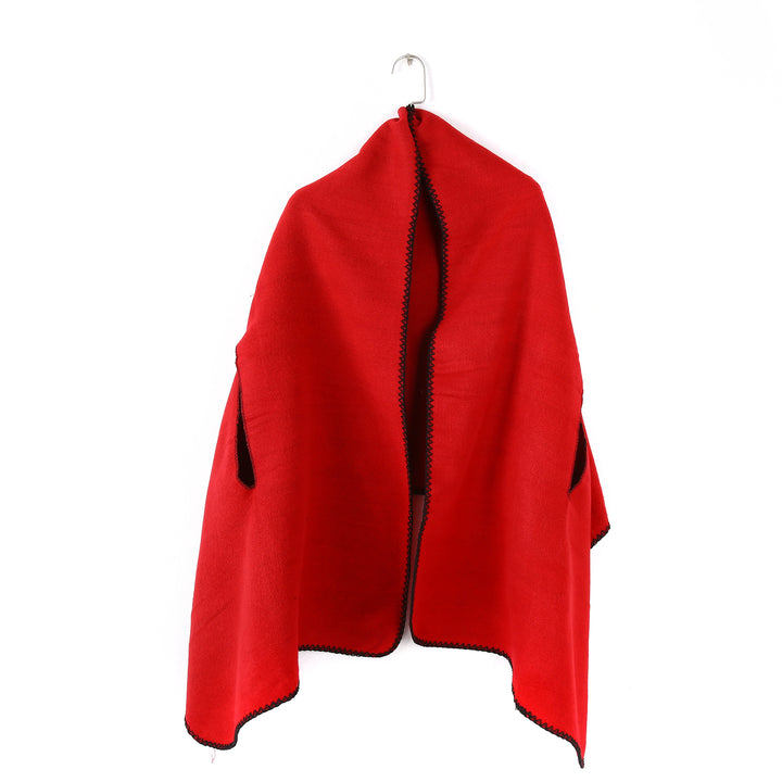 Women's oversized ruana poncho with arm openings and contrasting overlock stitching