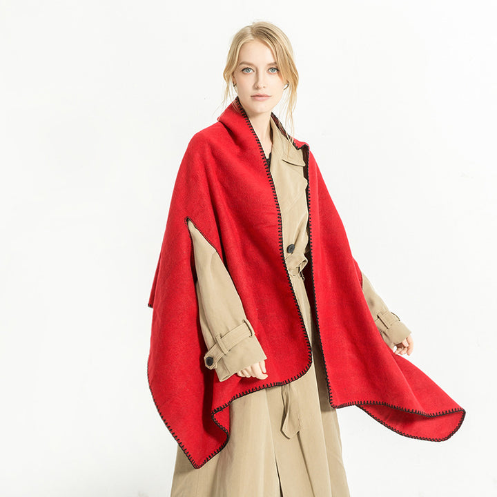 Women's oversized ruana poncho with arm openings and contrasting overlock stitching