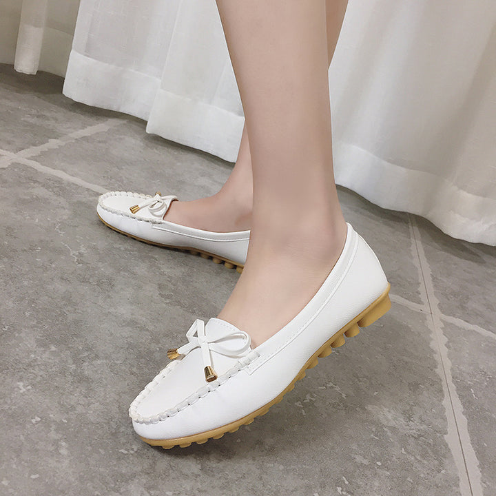 Women's slip-on moccasin with textured driver sole, decorative bow, and cushioned comfort footbed Mune Fashion