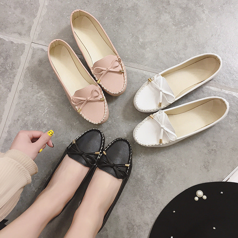 Women's slip-on moccasin with textured driver sole, decorative bow, and cushioned comfort footbed Mune Fashion