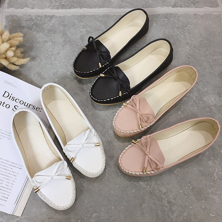 Women's slip-on moccasin with textured driver sole, decorative bow, and cushioned comfort footbed Mune Fashion