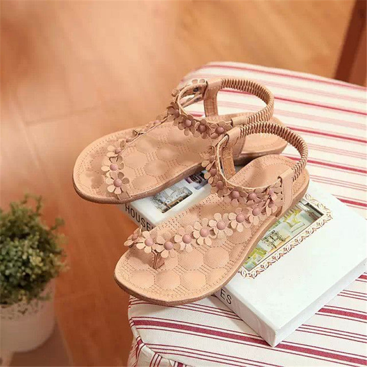 Women's toe post sandals with floral applique, elastic heel strap, and padded footbed Mune Fashion