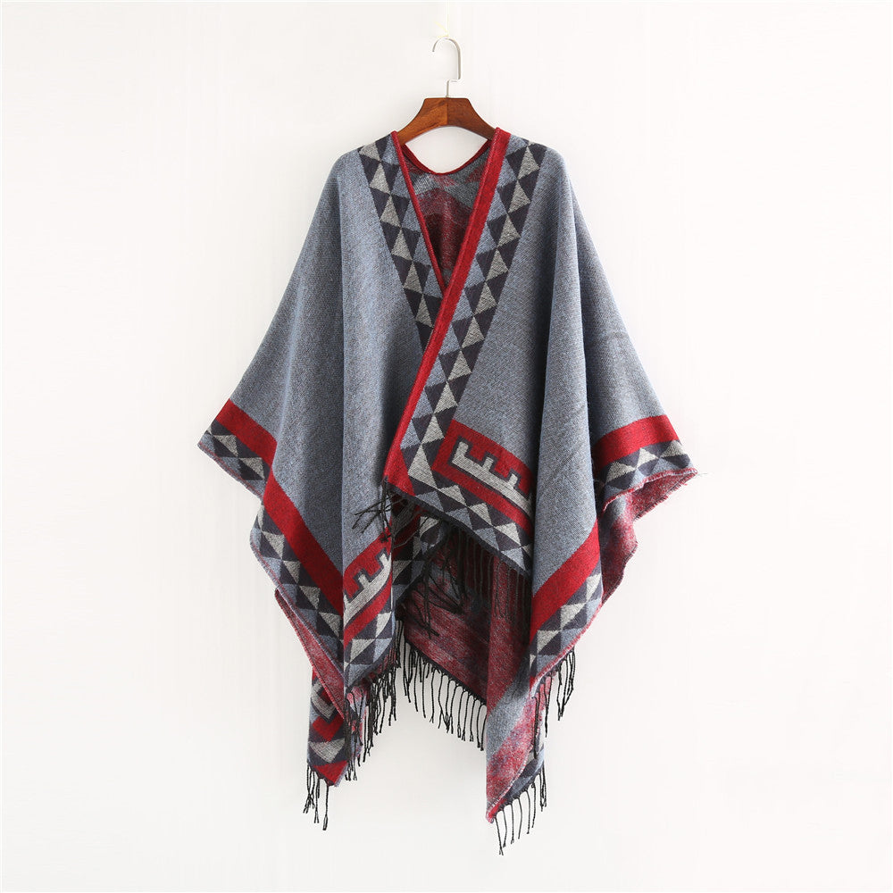 Women chunky knit poncho in wrap style with triangle jacquard and fringe hem Mune Fashion