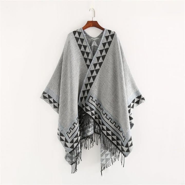 Women chunky knit poncho in wrap style with triangle jacquard and fringe hem Mune Fashion
