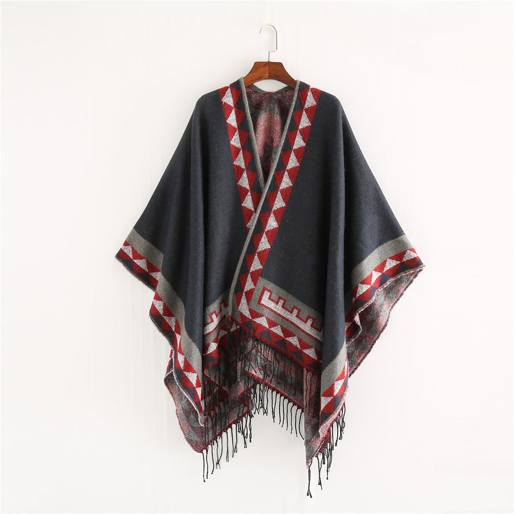 Women chunky knit poncho in wrap style with triangle jacquard and fringe hem Mune Fashion
